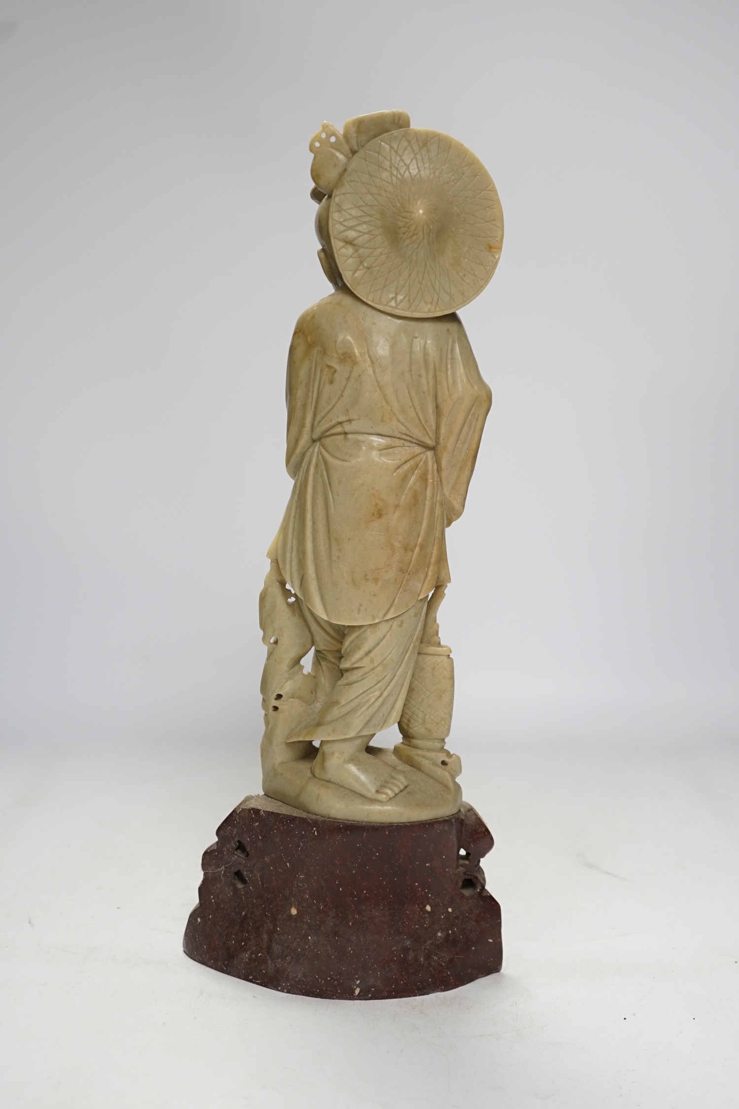 A tall Chinese soapstone figure of a fisherman, 40cm high. Condition - good